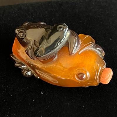 Carved Amber Koi Fish Snuff Bottle with Coral Squash Blossom Stopper