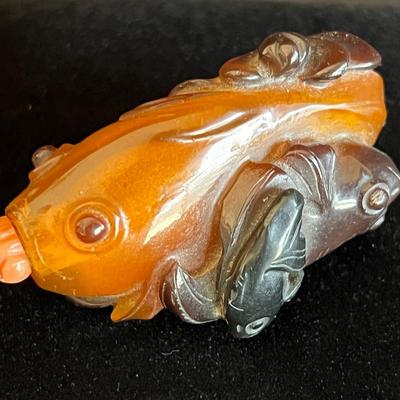 Carved Amber Koi Fish Snuff Bottle with Coral Squash Blossom Stopper