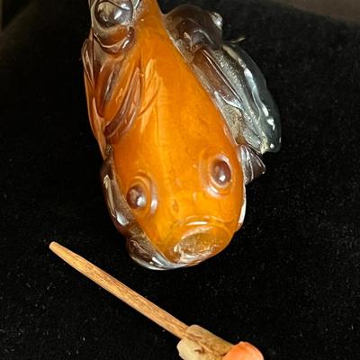 Carved Amber Koi Fish Snuff Bottle with Coral Squash Blossom Stopper