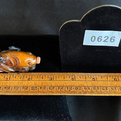 Carved Amber Koi Fish Snuff Bottle with Coral Squash Blossom Stopper