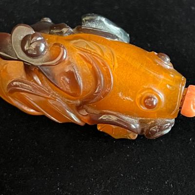 Carved Amber Koi Fish Snuff Bottle with Coral Squash Blossom Stopper