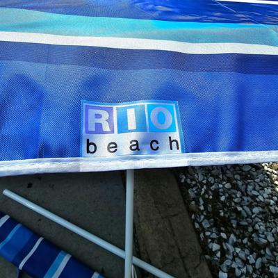 Rio Beach Umbrella, Coleman Cooler +Beach Towels.  (G-JS)
