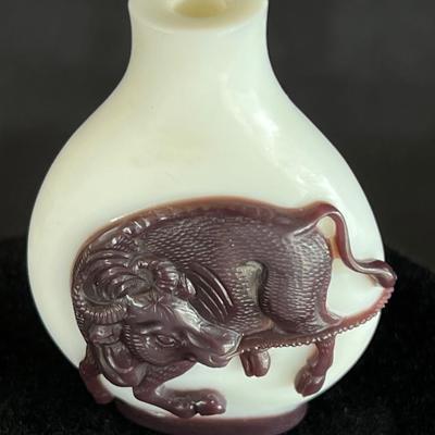 Peking Glass Snuff Bottle with Figure Pulling a Bull. Signed