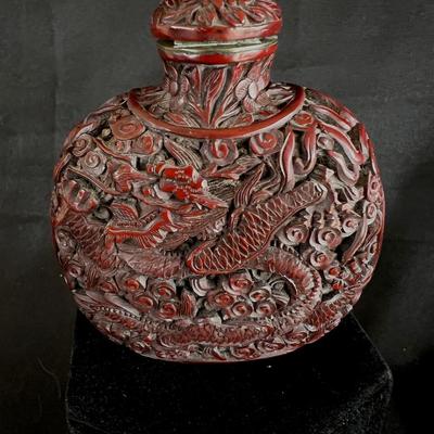 Intricately Carved Snake in a Garden Deep Reddish Brown Snuff Bottle