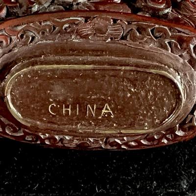 Intricately Carved Snake in a Garden Deep Reddish Brown Snuff Bottle