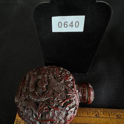 Intricately Carved Snake in a Garden Deep Reddish Brown Snuff Bottle
