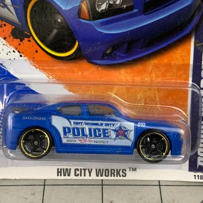 #94 Hot Wheels: '64 Corvette Sting Ray, Police City Works and Batmobile
