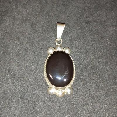 STERLING SILVER AND BLACK ONYX PENDANT