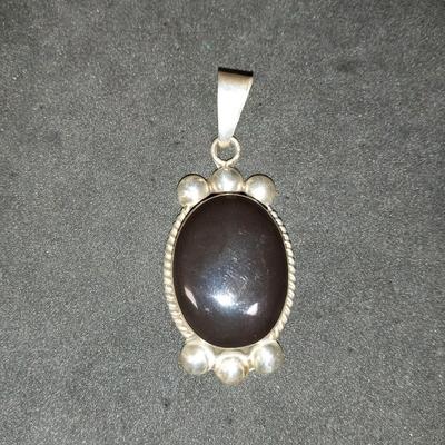 STERLING SILVER AND BLACK ONYX PENDANT