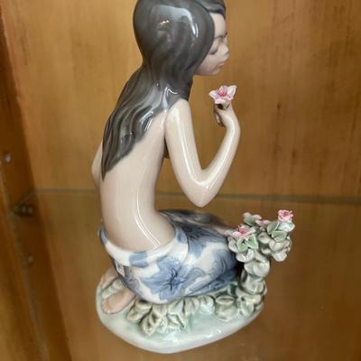 Lladro in a tropical garden