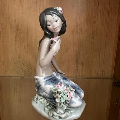 Lladro in a tropical garden