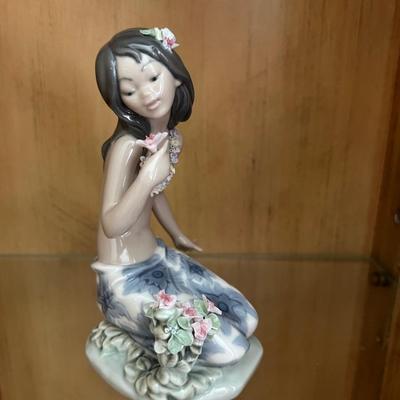 Lladro in a tropical garden