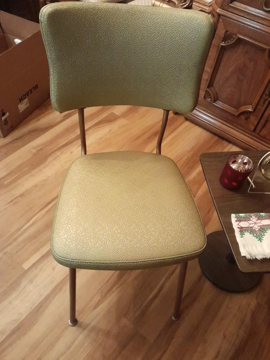 Vinyl kitchen chair with retro wooden end table and collectables
