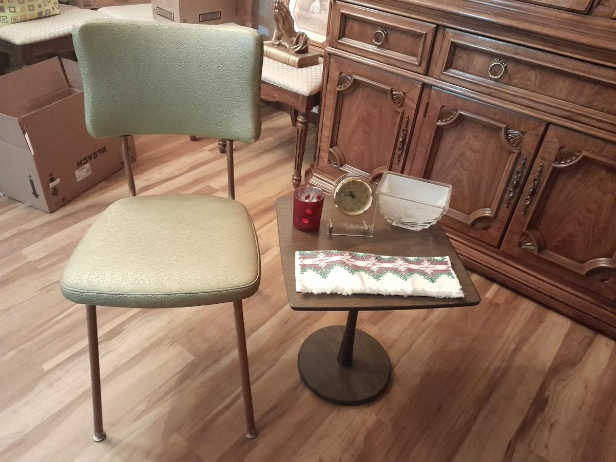 Vinyl kitchen chair with retro wooden end table and collectables