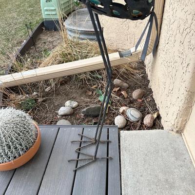 METAL YARD CRANE AND A CACTUS IN A FLOWER POT