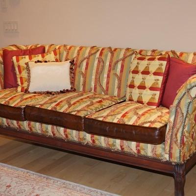 ARTISTIC OLD HICKORY SOFA IN FABRIC OF THREAD PILES AND VIBRANT PATTERN. BROWN LEATHER TRIM