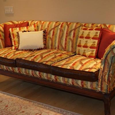 ARTISTIC OLD HICKORY SOFA IN FABRIC OF THREAD PILES AND VIBRANT PATTERN. BROWN LEATHER TRIM
