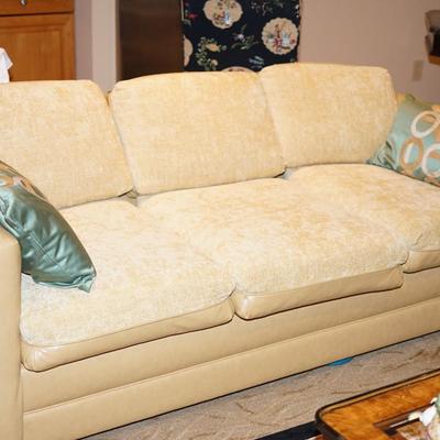 CONTEMPORARY THREE CUSHION SOFA SLEEPER . YELLOW TONE LEATHER W/ SOFT COTTON BLEND UPHOLSTERY