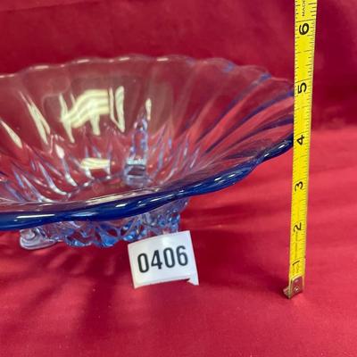 Vtg light blue footed glass bowl with curved edge