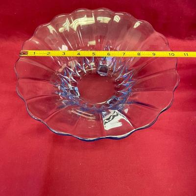Vtg light blue footed glass bowl with curved edge