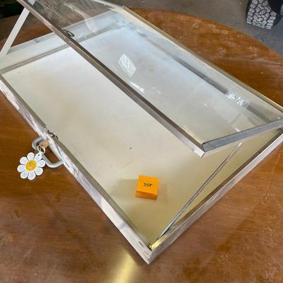 Metal flat display case with angled top