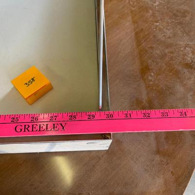 Metal flat display case with angled top