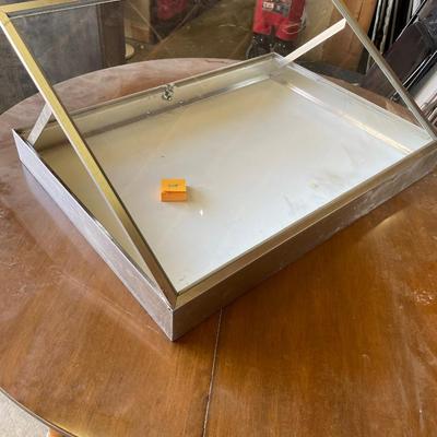 Metal flat display case with angled top