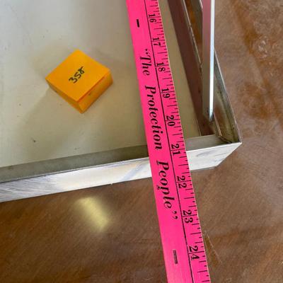 Metal flat display case with angled top