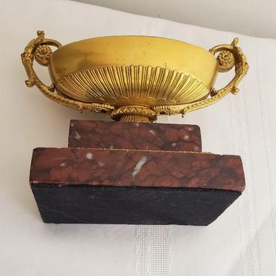Heavy metal and marble dish on marble