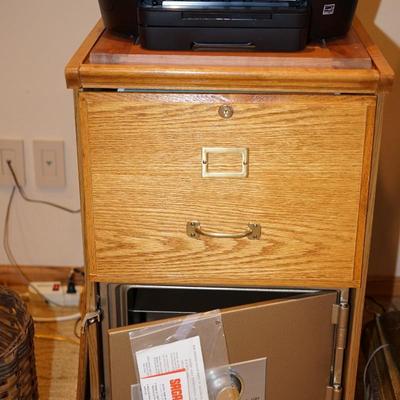 OAK TWO DRAWER FILE CABINET W/ CONCEALED SAFE BELOW.