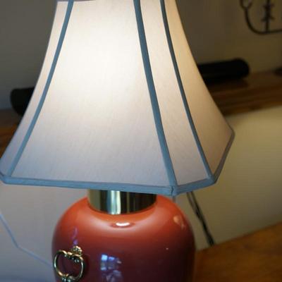 MODERN STYLE ASIAN PORCELAIN TABLE LAMPS IN RUST ORANGE TONES, BRASS RINGS AND PLATEAUS.