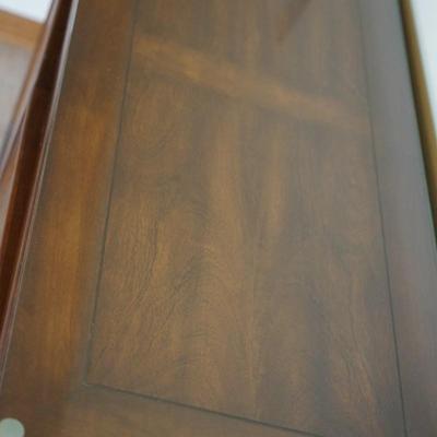 MODERN ASIAN STYLE TWO DOOR WOOD CABINET WITH BRASS PEDAL PULLS.