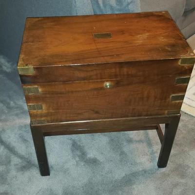 Brass and wood campaign chest on stand