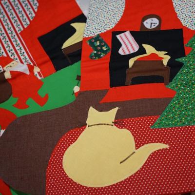 HOLIDAY GROUPING. HAND CRAFTED SANTA IN FLANNEL SHIRT CARRYING BOUGHS OF GREENS AND GIFTS SITS ON CERAMIC RED TRUCK / THREE HAND CRAFTED...