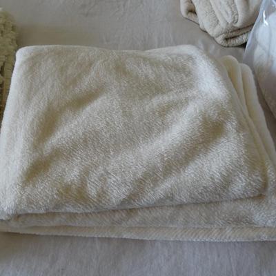 Set of Four Throw Blankets, One Quilt and Two Ivory Shag Rugs