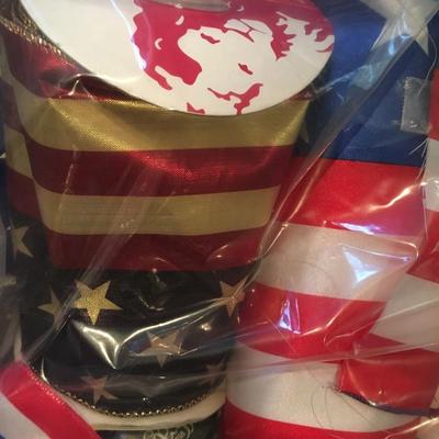 Bundles of assorted ribbons including red, white and blue