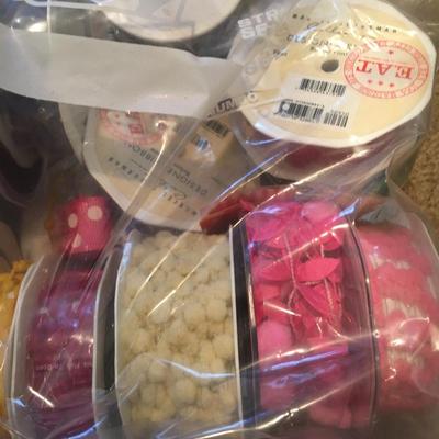 Bundles of assorted ribbons including red, white and blue