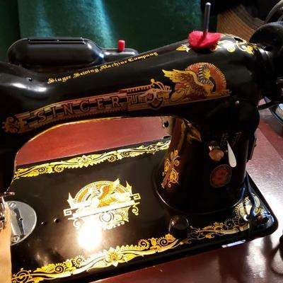 Singer Golden Sphinx sewing machine in cabinet