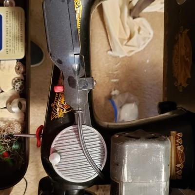 Singer Golden Sphinx sewing machine in cabinet
