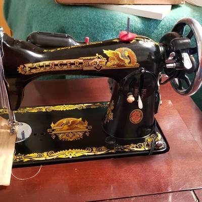 Singer Golden Sphinx sewing machine in cabinet