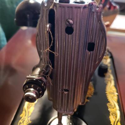 Singer Golden Sphinx sewing machine in cabinet