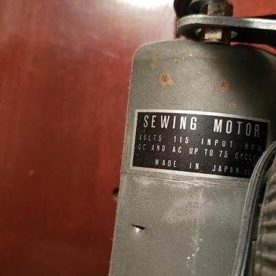 Singer Golden Sphinx sewing machine in cabinet