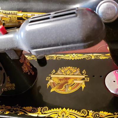 Singer Golden Sphinx sewing machine in cabinet