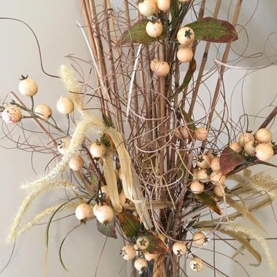 Dry floral arrangement in glass vase