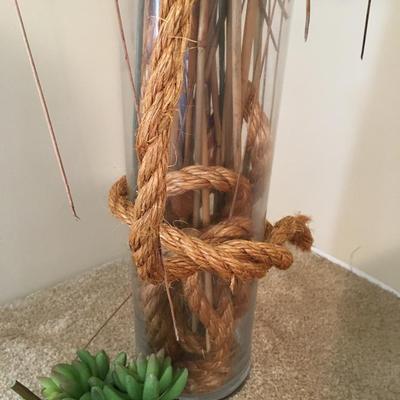 Dry floral arrangement in glass vase