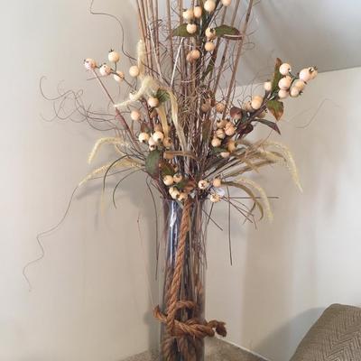Dry floral arrangement in glass vase