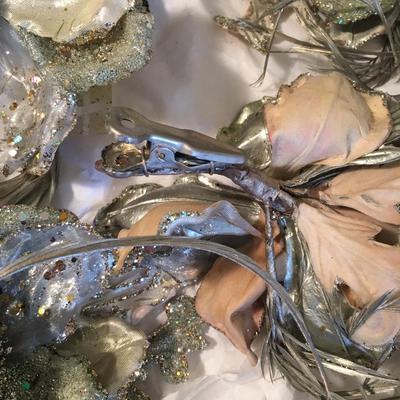 12 silver floral decorations with feather accents