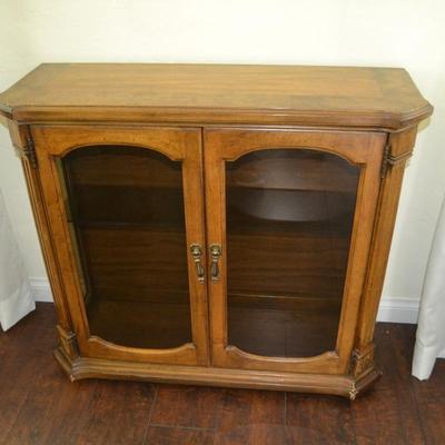 LOT 221 VINTAGE CABINET WITH GLASS DOORS AND GLASS SHELVES