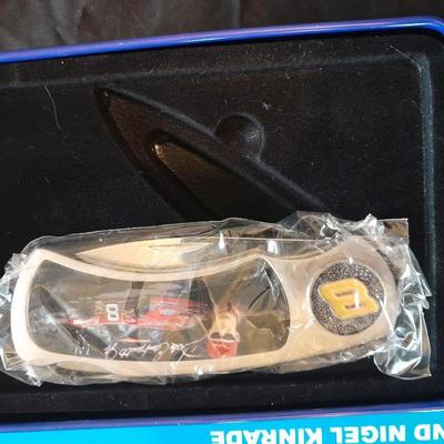HARDBACK BOOK THE DRIVERS OF NASCAR. AND A NEW DALE EARNHARDT JR. KNIFE IN A TIN