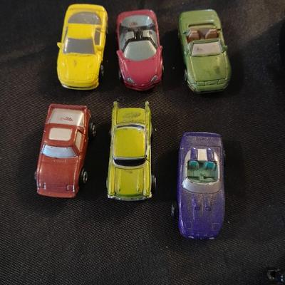 TWELVE MICRO MACHINE CARS  CAR CASE KEYCHAIN AND MICRO CHARGER !